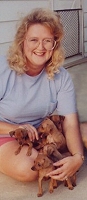 Mary Ann with puppies
